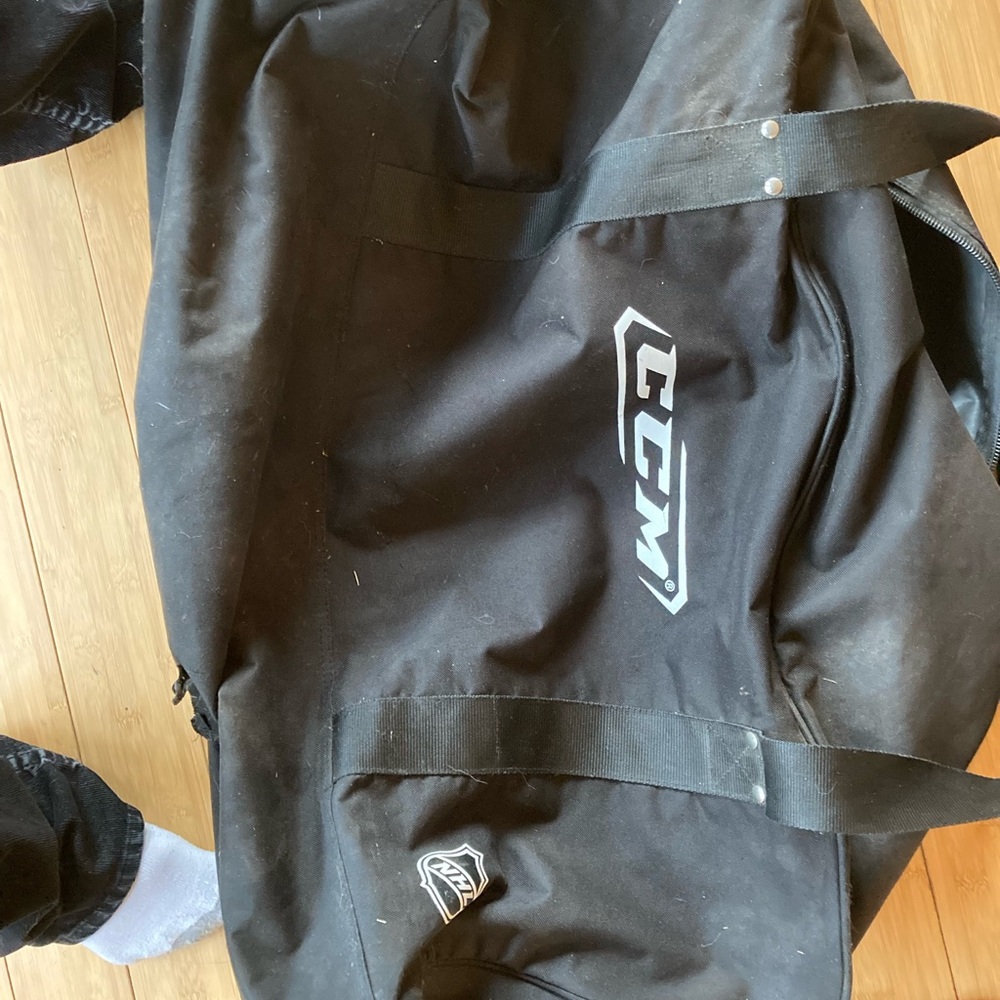 Black CCM hockey bag.